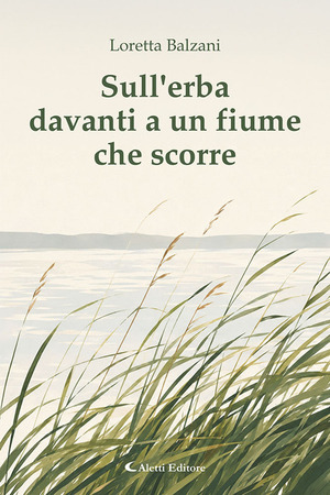 Sull'erba davanti a un fiume che scorre